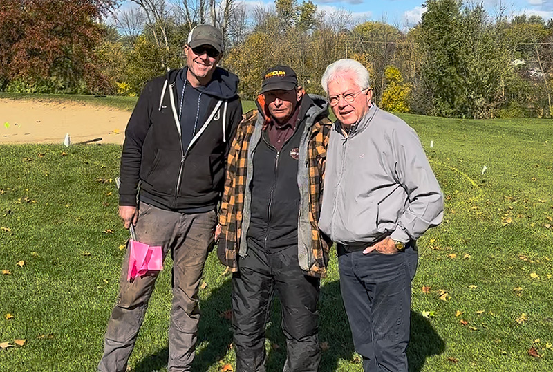 Drew Putzer, CGCS, Mike Ufken and Bill Kubly standing outdoors