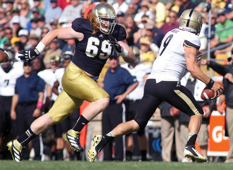 Tony Springmann playing football at Notre Dame